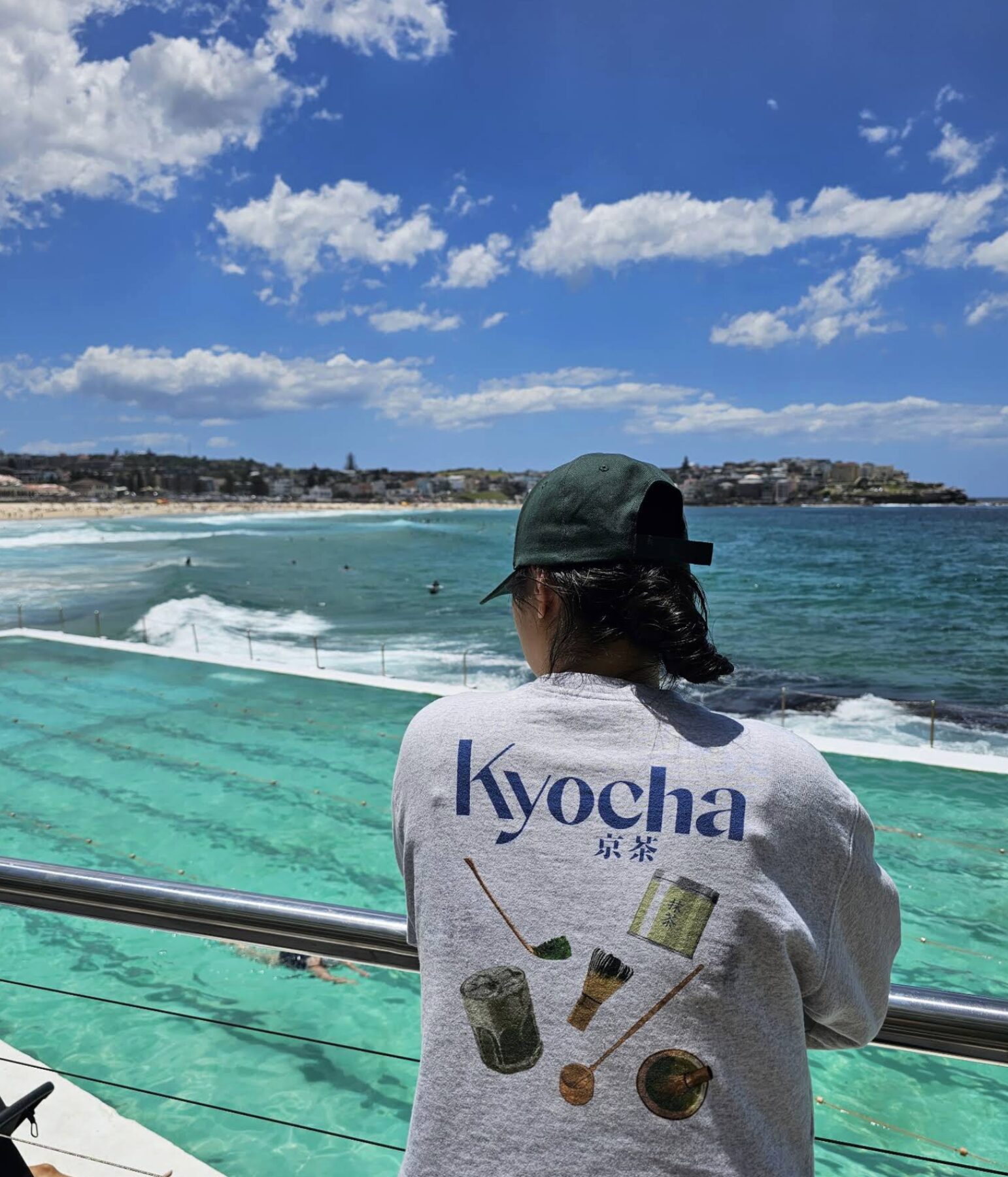 Guest wearing a custom Kyocha matcha-tools sweatshirt