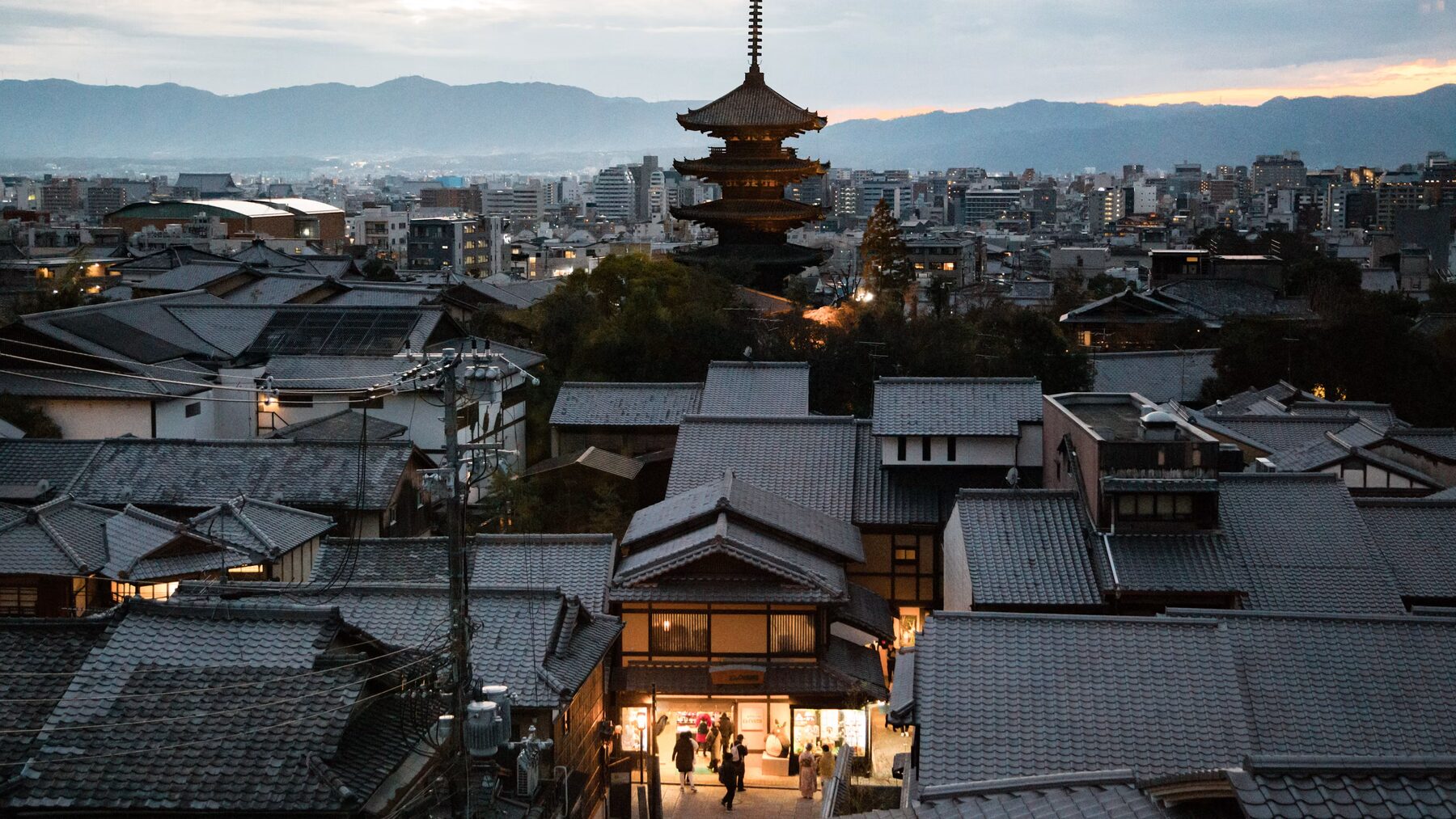Kyoto rooftops and a five-story pagoda at dusk